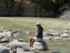 Caro dipping her feet in the Rio Grande.
